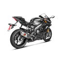 A silver motorcycle exhaust system with a black and red logo, featuring four exhaust pipes converging into a single muffler. The AKRAPOVIC Akrapovic Full System YZF-R6 2007-23 enhances engine performance, complete with a heat shield and sleek design.
