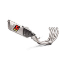 A silver motorcycle exhaust system with a black and red logo, featuring four exhaust pipes converging into a single muffler. The AKRAPOVIC Akrapovic Full System YZF-R6 2007-23 enhances engine performance, complete with a heat shield and sleek design.