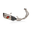 The Akrapovic Full System YZF R7 2021-23 is a sleek silver titanium racing exhaust for motorcycles, featuring dual pipes and a carbon fiber cover. It has the iconic AKRAPOVIC logo in red and yellow, includes mounting brackets, and highlights Akrapovič dyno performance.