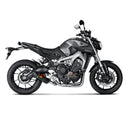 The Akrapovic Full System for Yamaha MT09/XSR900 by AKRAPOVIC is a racing exhaust with a sleek metallic finish, featuring multiple curved pipes leading to a black carbon fiber muffler adorned with a red and yellow logo.