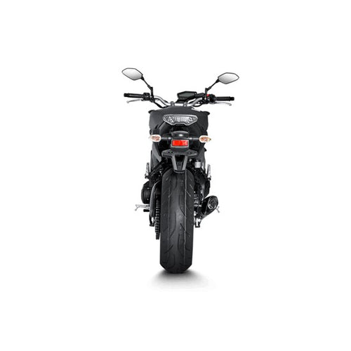 The Akrapovic Full System for Yamaha MT09/XSR900 by AKRAPOVIC is a racing exhaust with a sleek metallic finish, featuring multiple curved pipes leading to a black carbon fiber muffler adorned with a red and yellow logo.