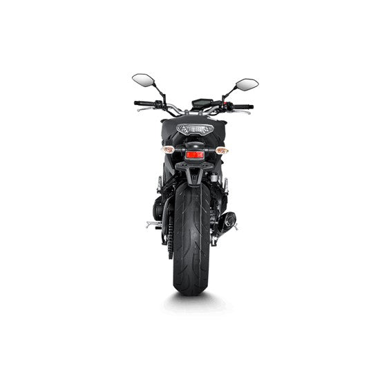 The Akrapovic Full System for Yamaha MT09/XSR900 by AKRAPOVIC is a racing exhaust with a sleek metallic finish, featuring multiple curved pipes leading to a black carbon fiber muffler adorned with a red and yellow logo.