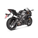 The Akrapovic Slip On Muffler YZF-R6 by AKRAPOVIC boasts a sleek, silver metallic design ideal for racing. It features the Akrapovic logo, a titanium finish, and a high-mounted bracket for added polish.