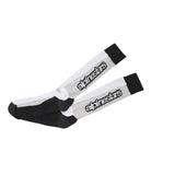 The Alpinestars Touring Summer Socks from ALPINESTARS boast a black and white knee-high design with the iconic logo in black. They offer riding comfort with moisture-wicking performance, featuring a black toe and heel, displayed flat on a plain background.